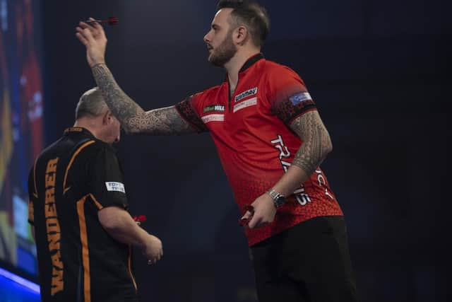 Joe Cullen throws on his way to victory at the World Darts Championship against Wayne Jones. Picture courtesy of Lawrence Lustig/PDC.