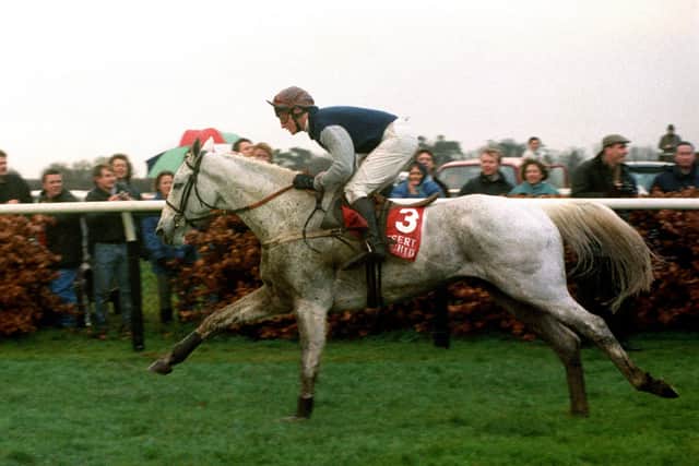 Desert Orchid and Richard Dunwoody surge clear at the end of the 1990 King George Chase.