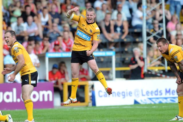 DELIGHT: Castleford's Adam Milner celebrates at the final hooter after beating Huddersfield Giants in the 2011 Challenge Cup quarter-final. Picture: Jonathan Gawthorpe.