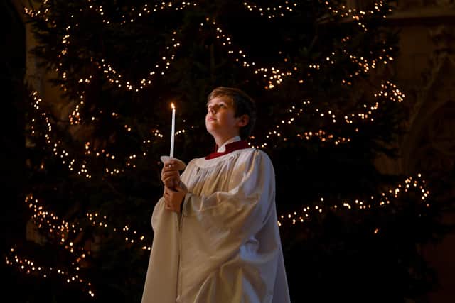 Let there be light - York Minster chorister Martyn Sketchley prepares for Christmas. Photo: Simon Hulme.