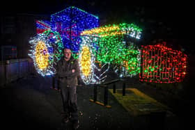 Andrew Wilkinson with his Christmas lights John Deere tractor replica.