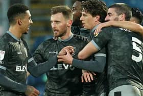 Sheffield Wednesday players celebrate after Adam Reach, third from right, fired them into the lead at Blackburn Rovers. Pictures: Getty Images