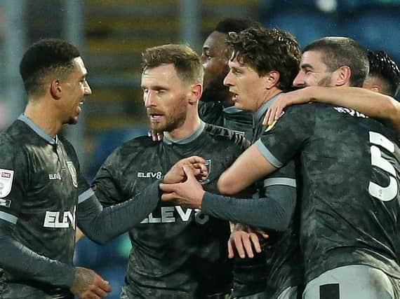 Sheffield Wednesday players celebrate after Adam Reach, third from right, fired them into the lead at Blackburn Rovers. Pictures: Getty Images