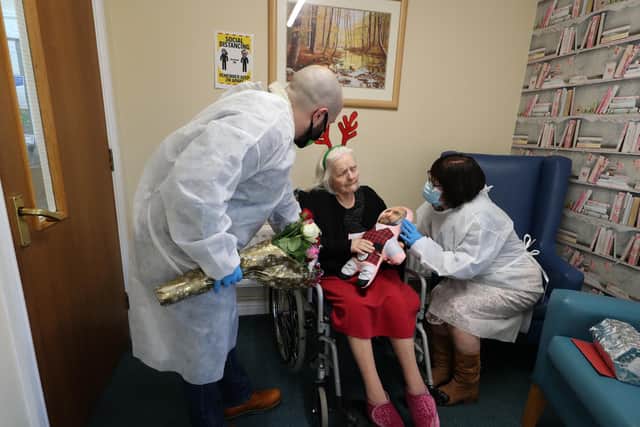 Mary Orme (right) and her son Michael McKimm greet Rose McKimm during Christmas Day visit at Aspen Hall care home, Hunslet