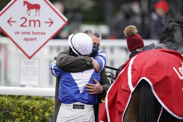 Bryony Frost embraces trainer Paul Nicholls after Frodon's King George VI win.