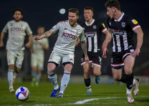 TRANSFORMED: Bradford City's Billy Clarke in action during last week's win at Grimsby Town. Picture: Bruce Rollinson