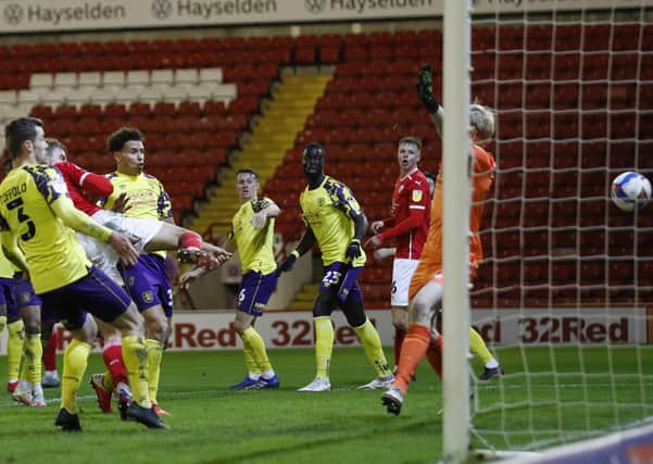 LATE BLOW: Barnsley's Malik Helik scores his side's winning goal against Huddersfield Town at Oakwell. Picture: Darren Staples/Sportimage