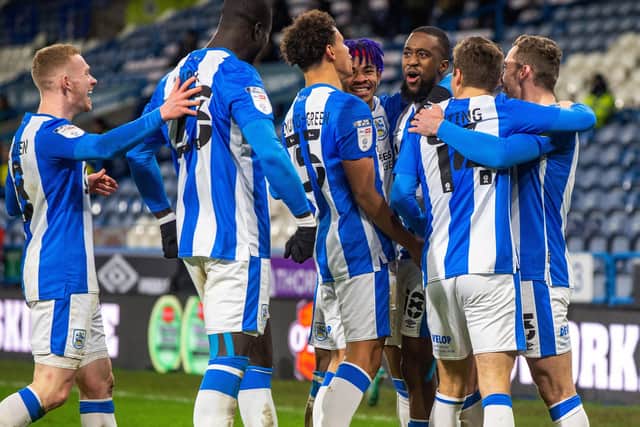 OPENER: Huddersfield Town players celebrate taking the lead. Picture: Bruce Rollinson.