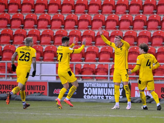 OPENER: 
Cauley Woodrow celebrates the opening goal for Barnsley against Rotherham. Picture: Steve Riding.
