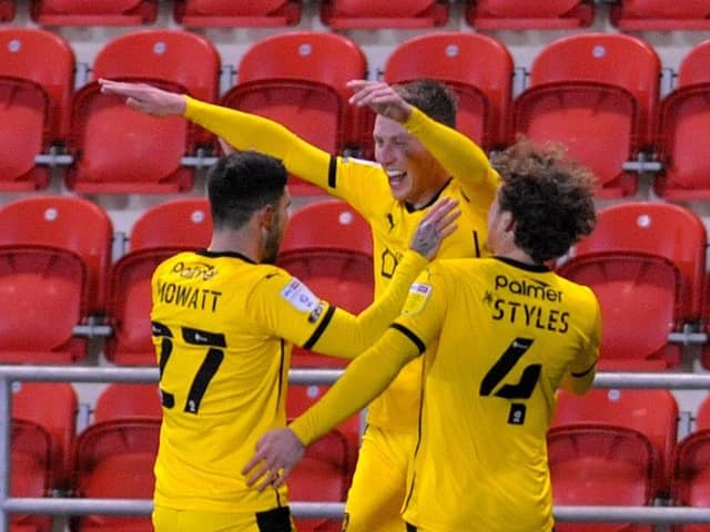 Cauley Woodrow celebrates his goal for Barnsley. Pictures: Steve Riding