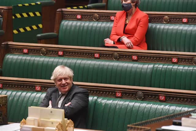 Handout photo issued by UK Parliament of Prime Minister Boris Johnson and Theresa May during the debate in the House of Commons on the EU (Future Relationship) Bill. Photo: UK Parliament/Jessica Taylor