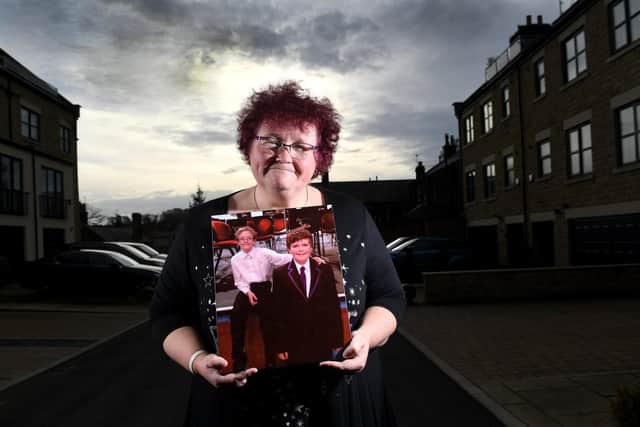Pictured, domestic abuse survivor Claire Throssell pictured with a picture of her sons Paul and Jack who was murdered by abusive partner Darren Sykes, Penistone..24th November 2020..Picture by Simon Hulme