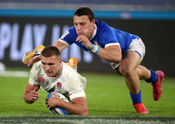 England's Henry Slade dives in to score his sides fifth try during the Guinness Six Nations match against Italy in Rome. Picture: Marco Lacobucci/PA