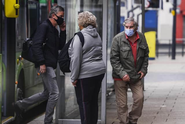 People wearing masks in Leeds city centre earlier this year. Pic: SWNS