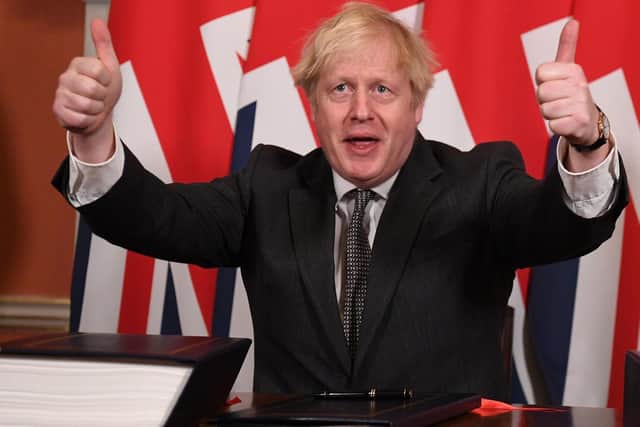 Prime Minister Boris Johnson gives a thumbs up gesture after signing the EU-UK Trade and Cooperation Agreement at 10 Downing Street, Westminster. Pic by PA