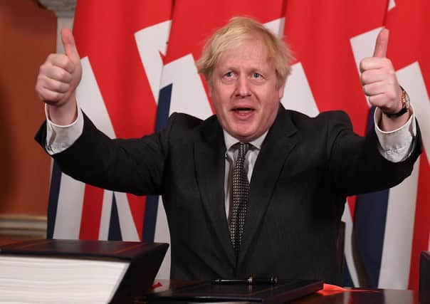 Prime Minister Boris Johnson gives a thumbs up gesture after signing the EU-UK Trade and Cooperation Agreement. Picture: PA