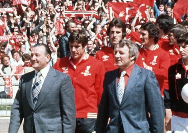 Finest hour: Liverpool manager Bob Paisley, left, and Manchester United manager Tommy Docherty leading their teams onto the pitch for the 1977 FA Cup final. Picture: PA