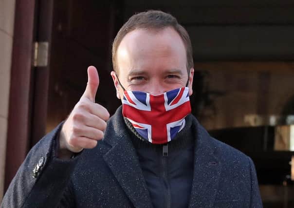 Heath Secretary Matt Hancock gives a thumbs up as he leaves Millbank in Westminster, central London, after the news that a Covid-19 vaccine from Oxford University and AstraZeneca was approved for use in the UK. Picture: Steve Parsons/PA Wire