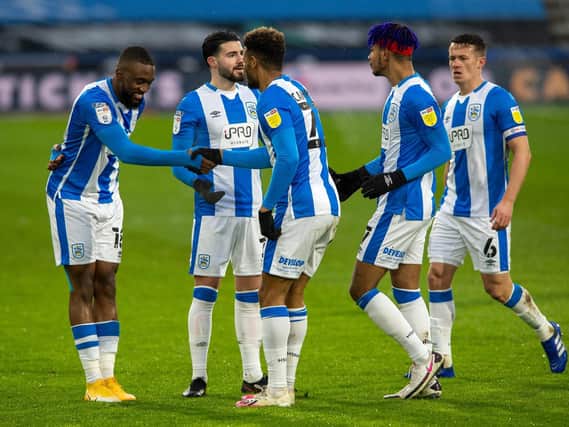 Huddersfield Town players celebrate with Fraizer Campbell after his early goal against Reading. Picture: Bruce Rollinson.
