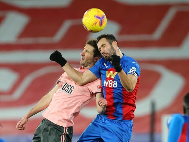 CHALLENGE: Chris Basham competes for the ball with Crystal Palace's Luka Milivojevic