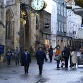 Shoppers walk through York City Centre. More than three quarters of England's population is being ordered to stay at home to stop the spread of coronavirus though York and North Yorkshire are in Tier 3. PA Photo