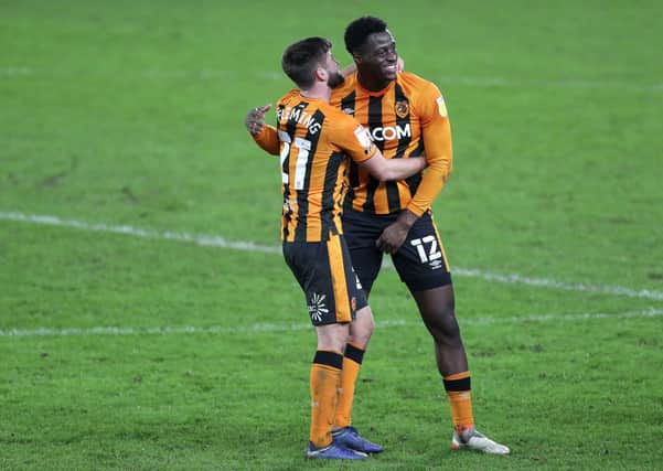 Put it there: Hull City's Brandon Fleming (front) and Josh Emmanuel celebrate the win over Charlton Athletic. Picture:  Richard Sellers/PA Wire.