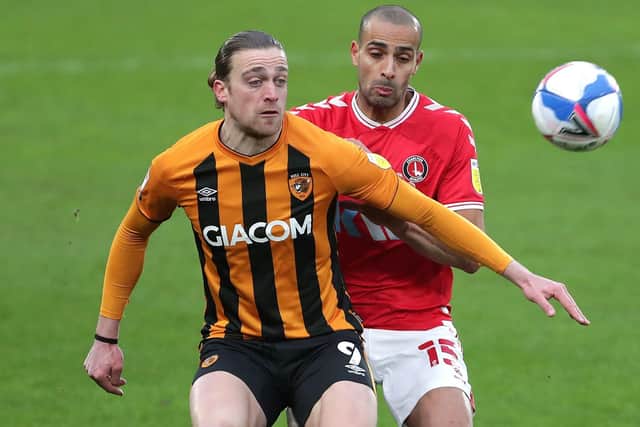 Seeing red: Hull City's Tom Eaves (left) and Charlton Athletic's Darren Pratley battle for the ball - with the latter later sent off in the 2-0 defeat. Picture: Richard Sellers/PA Wire.