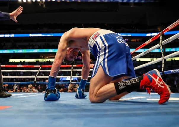 DOWN AND OUT: Luke Campbell kneels on the canvas after taking a fierce body shot by Ryan Garcia in Dallas, the Hull fighter losing out in the fifth round Picture: Tim Warner/Getty Images.