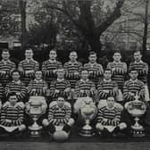 Douglas ‘Duggy’ Clark: Son of a Cumbrian coal merchant, Douglas Clark, part of the Huddersfield team that proudly display their four-trophy haul from 1914-15. Picture: Elizabeth James & Imperial War Museum/1917 Huddersfield Rugby League