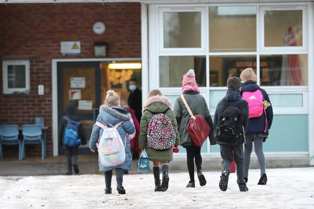 Pupils arrive at Manor Park School and Nursery in Knutsford, Cheshire, as schools across England return after the Christmas break. PA Photo.