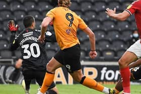 Hull City's Mallik Wilks, far right, fires the ball past Middlesbrough goalkeeper Dejan Stojanovic to put his side 2-1 up at the KCOM Stadium last July. Picture: Getty Images