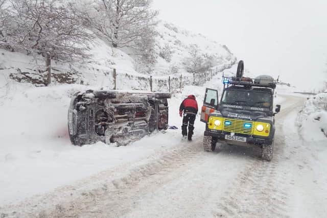Woodhead Mountain Rescue Team has to raise £40,000 for a new Land Rover- pictured above on a previous rescue mission involving an overturned vehicle.