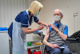 The Government has announced plans to delay giving people the second dose of the Covid vaccine in order to give as many people as possible the first dose. Pictured: Ralph Evans, 88, receiving the Oxford University/AstraZeneca COVID-19 vaccine at Pontcae Medical Practice in Merthyr Tydfil. PA.