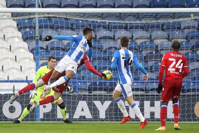 Huddersfield Town's Fraizer Campbell scores against Reading. Picture: Martin Rickett/PA