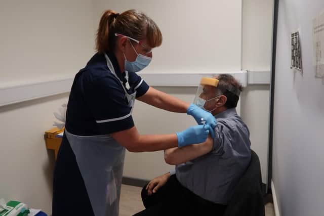 Camille El-Khatib, 73, who has worked for Mid Yorkshire Hospitals Trust since 1985, was one of the first members of NHS staff to receive the first dose of the Pfizer vaccine on Tuesday afternoon. Photo: Mid Yorkshire Hospitals NHS Trust