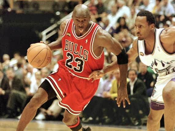 Michael Jordan (left) in  action with the Chicago Bulls in 1998. (AFP via Getty Images).