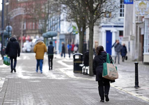 Shoppers come to terms with the lockdown - and weather - in the centre of Doncaster.
