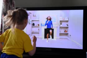 Four-year-old Lois Copley-Jones, who is the photographer's daughter, takes part in a live streamed broadcast of PE with fitness trainer Joe Wicks on the first day of the nationwide school closures on March 23, 2020 (Photo by Gareth Copley/Gareth Copley)