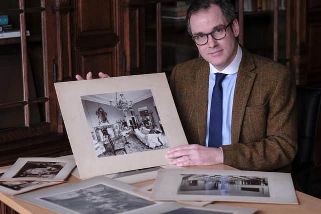 Scarborough Museums Trust chief executive Andrew Clay with one of the donated photographs
