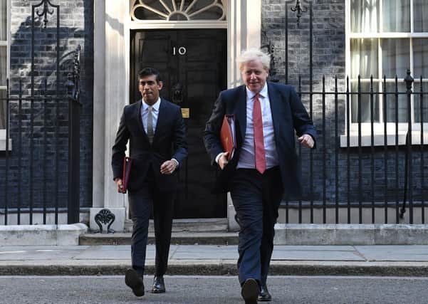 Boris Johnson (right) and Chanclelor Rishi Sunak (left) are under pressure to define the Government's levelling up agenda.
