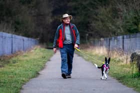 Andrew White, presenter of Walks around Britain, as he and his new dog Magic set's off on one of his favourite walks over and around Conisbrough viaduct, Doncaster. Image: James Hardisty