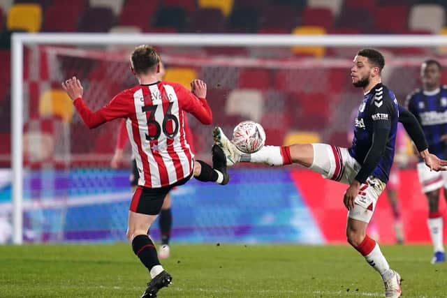 Middlesbrough's Marcus Browne (right) and Brentford's Fin Stevens (left) (Picture: PA)
