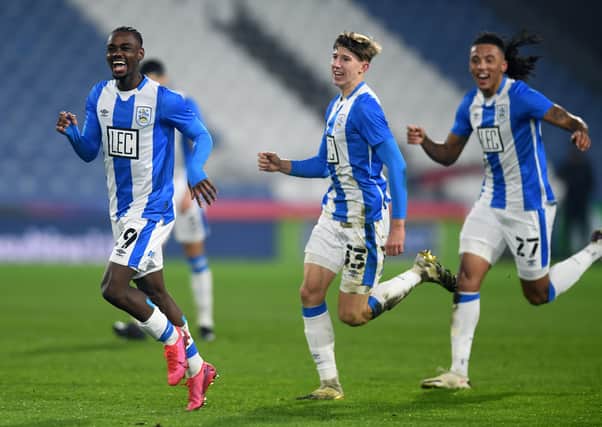 Huddersfield Town's Aaron Rowe, left, celebrates his goal against Plymouth (Picture: Jonathan Gawthorpe)