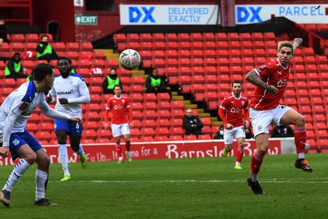 Barnsley's Dominik Frieser has his hooked shot cleared from Tranmere's Lee O'Connro.
 (
Picture: Jonathan Gawthorpe)