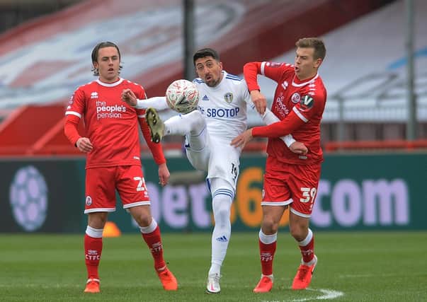 Leeds player Pablo Hernandez is challenged by Crawley Town's Jake Hessenthaler (Picture: Simon Hulme)