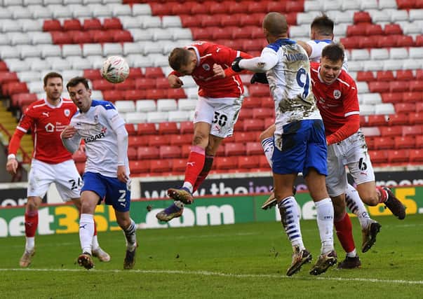 Barnsley's Michal Helik scores the opening goal against Tranmere (Picture: Jonathan Gawthorpe)