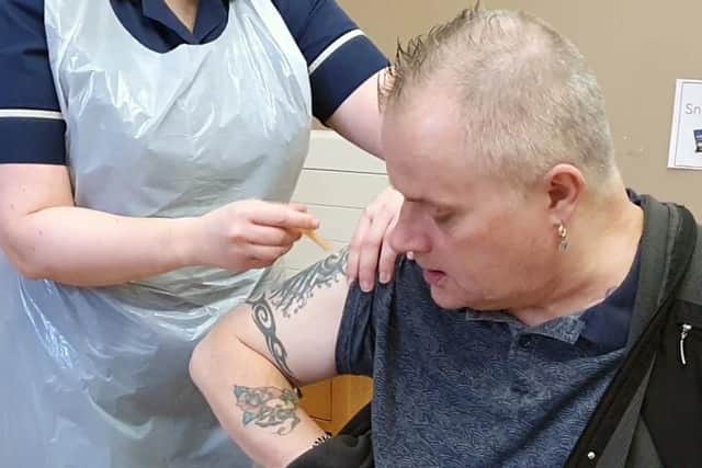 Saint Cecilia’s Nursing Home resident David Wheldon, receives his vaccination on the weekend. Photo credit: Submitted picture