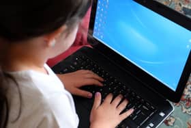 Campaigners are threatening legal action against the Government if it fails to step up its efforts to ensure all children can access remote education during the lockdown. PA Photo.