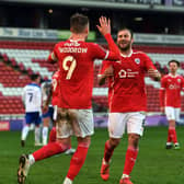 Barnsley's Cauley Woodrow celebrates with Herbie Kane after he scores from the spot to make it 2-0.  Pictures: Jonathan Gawthorpe