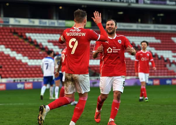 Barnsley's Cauley Woodrow celebrates with Herbie Kane after he scores from the spot to make it 2-0.  Pictures: Jonathan Gawthorpe
